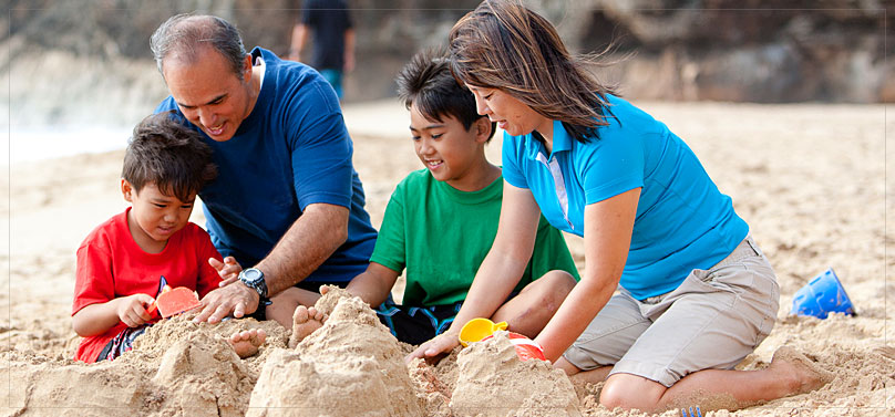 Image of a family playing on the beach